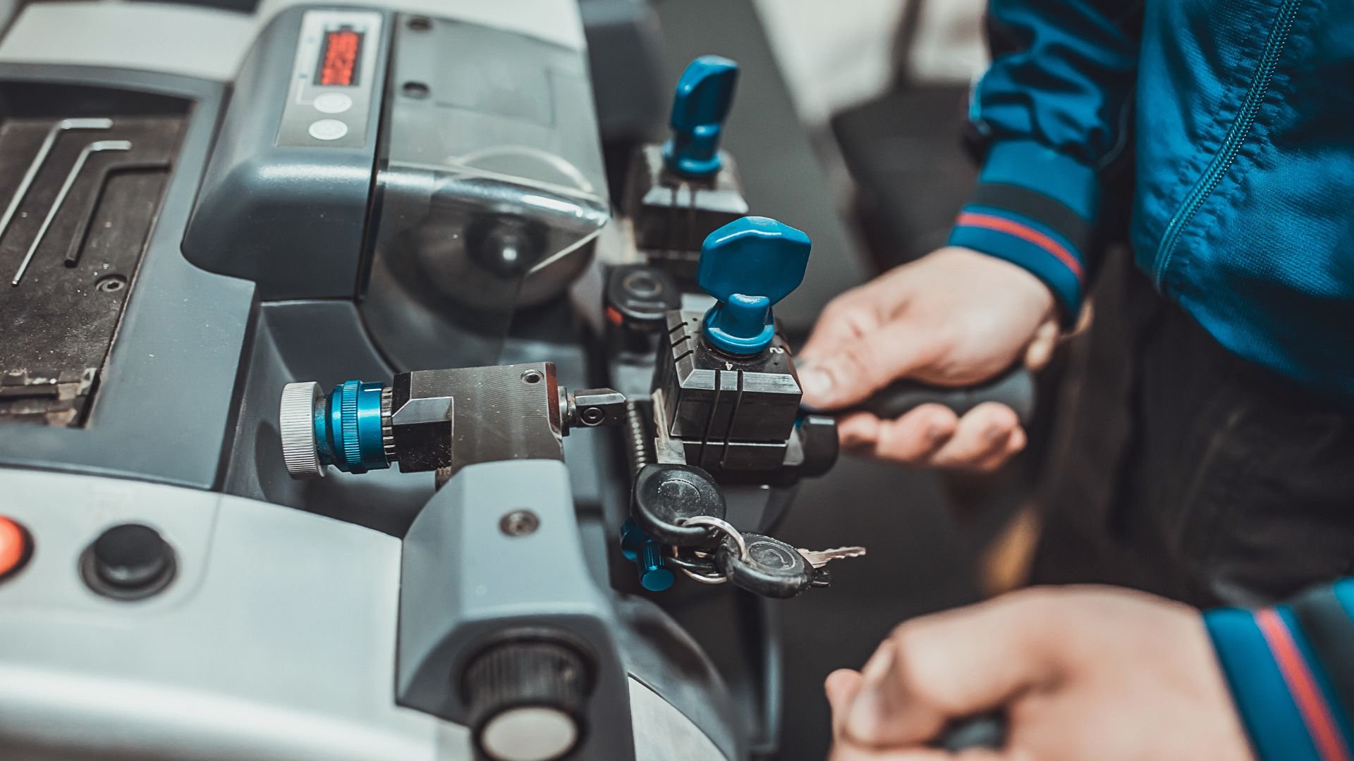 Industrial machinery control panel with blue knobs and precision equipment